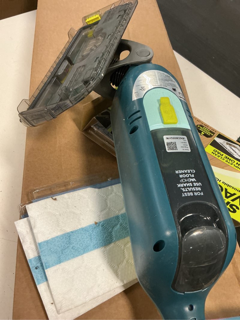 Condition photo showing As Is for shark vacmop reveal new cordless hard floor cleaner, vacuum & spray mop, powerful suction, lightweight, illumination light, includes 4 disposable pads, 12oz pet multi-surface cleaning solution, vm401 new vacmop reveal with 4 pads