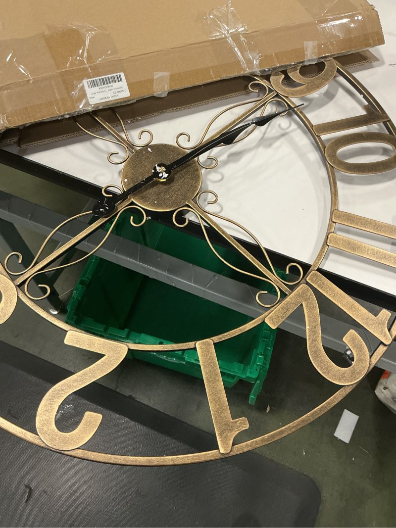 Condition photo showing As Is for Gold Wall Clock 16 Inch, Decorative Wall Clocks Battery-Operated, Modern Metal Round Clock Silent Non Ticking Arabic Numerals for Living Room Kitchen Mantel Bedroom Office, Gold Wall Decor Gold Arabic Number 16 Inch