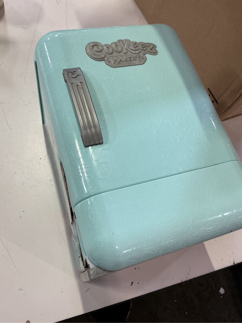 Condition photo showing Good Condition for cookeez makery freezy cakez. mix & decorate your plush best friend! place your cake mix in the freeze and be amazed when a scented, shivering, interactive plush friend comes out. styles may vary
