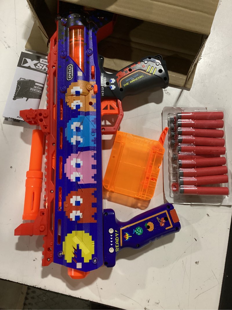 Condition photo showing As Is for xshot skins pro series 1 pac-man long shot blaster by zuru with 40 darts, air pocket technology darts and dart storage, outdoor toy, teens and adults