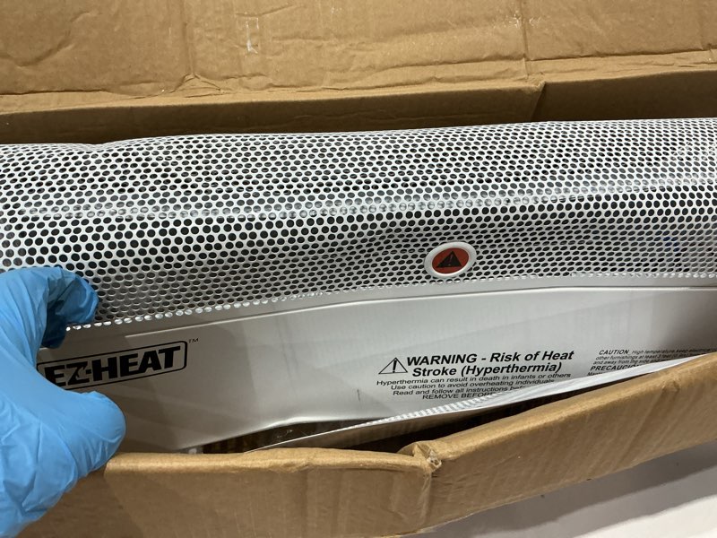 Condition photo showing As Is for ez-heat 1,500 watt baseboard space heater with adjustable thermostat, dent-proof end panels, overheat protection, tip-over switch, & stay-cool body, cz600