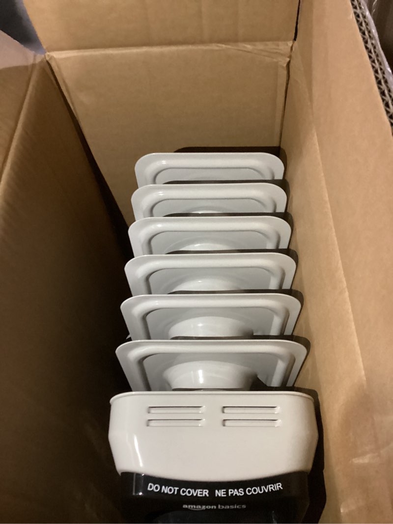 Condition photo showing As Is for Amazon Basics Portable Oil Radiator Heater for Indoor Use, 3 Heat Settings, Over-Heat Protection, ETL-certified Safety, 7 Oil-Filled Steel Fins, 1500W, 11"D x 14.8"W x 25.2"H, White