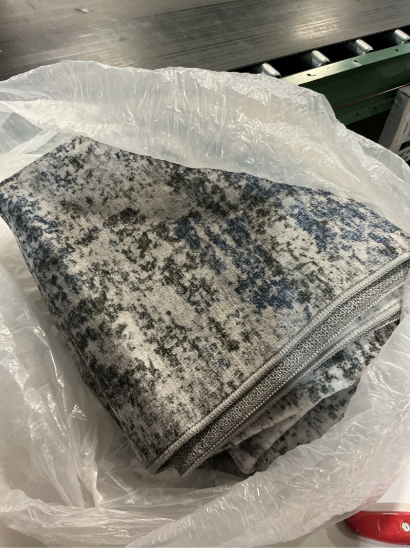 Condition photo showing item condition for Area Rug Living Room Washable Rugs: 5x7 Modern Neutral Abstract Low Pile Non Slip Floor Carpet - Large Soft Thin Stain Resistant Rug for Bedroom Dining Indoor Office Home, Blue Grey Blue Grey 5' x 7' (Rectangular)