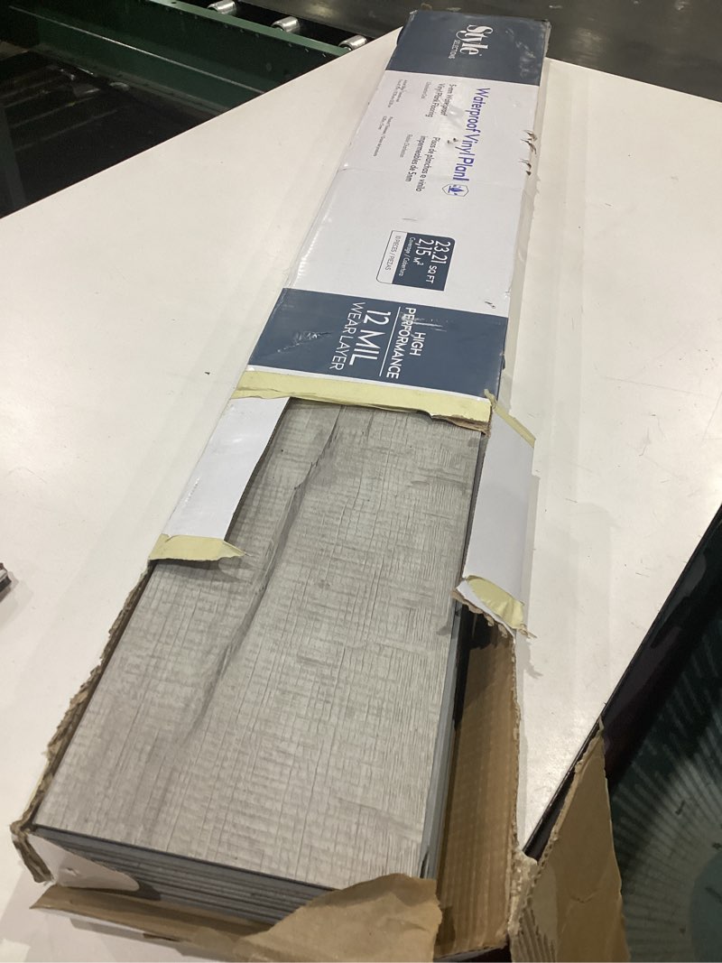 Condition photo showing As Is for style selections charleston oak 12-mil x 7-in w x 48-in l waterproof luxury vinyl plank flooring