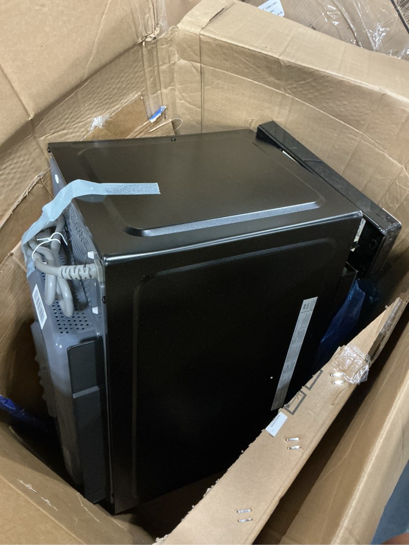 Condition photo showing As Is for ge 4-in-1 countertop microwave oven, 1.0 cu ft, 1050w convection microwave with air fry & broil, compact and quiet, stainless steel, ideal for apartments, dorms & offices, gcst10a1wss