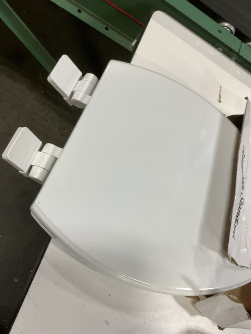 Condition photo showing As Is for american standard moments wood white elongated soft close toilet seat