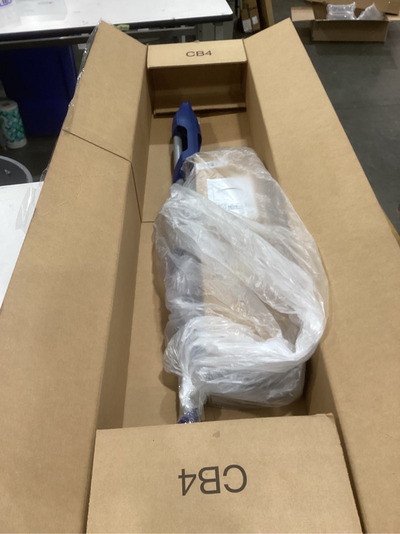 The image shows a long, thin item packaged in a cardboard box, which appears to be a side window deflector or vent visor for a vehicle.