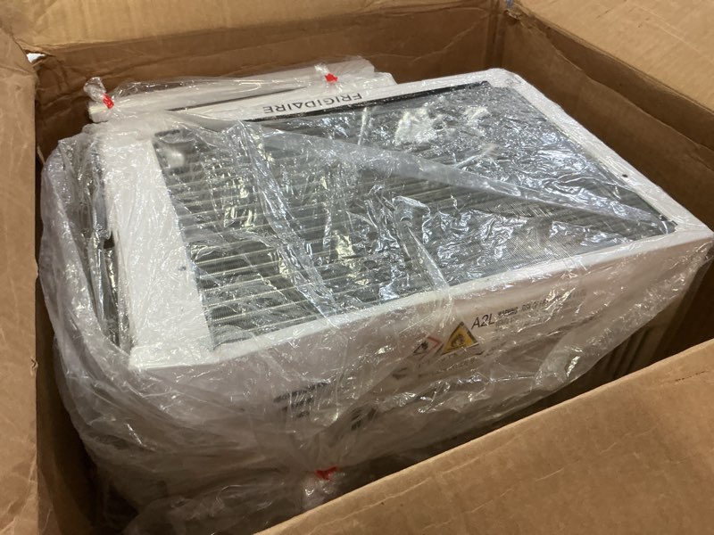 Condition photo showing As Is for frigidaire 6,000 btu window air conditioner with remote control, cools up to 250 sq. ft., quiet operation, eco mode, 3 fan speeds, auto restart, white 6,000 btu electronic controls