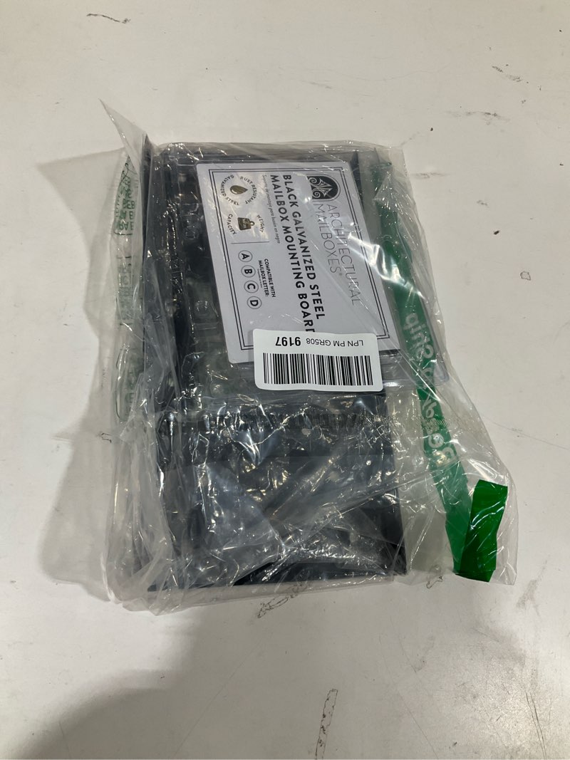 Condition photo showing As Is for architectural mailboxes umbs0b06am mounting board, steel accessory, no size, black