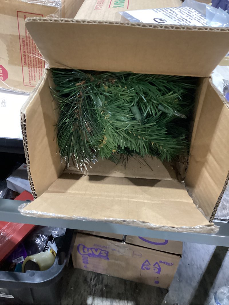 Condition photo showing As Is for national tree company 9 ft pre-lit crestwood spruce artificial christmas garland, christmas decoration with glitter, pinecones, red berries, 50 clear lights, 180 tips, green plug in tree