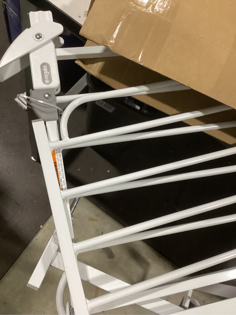 Condition photo showing As Is for Similar to product Regalo 38.5-Inch Extra Wide Baby Gate – Pressure Mount Baby and Pet Safety Gate for Bottom of Stairs & Doorways – Tested and Trusted, American Designed, American Owned White 29-38.5\"W x 30\"H