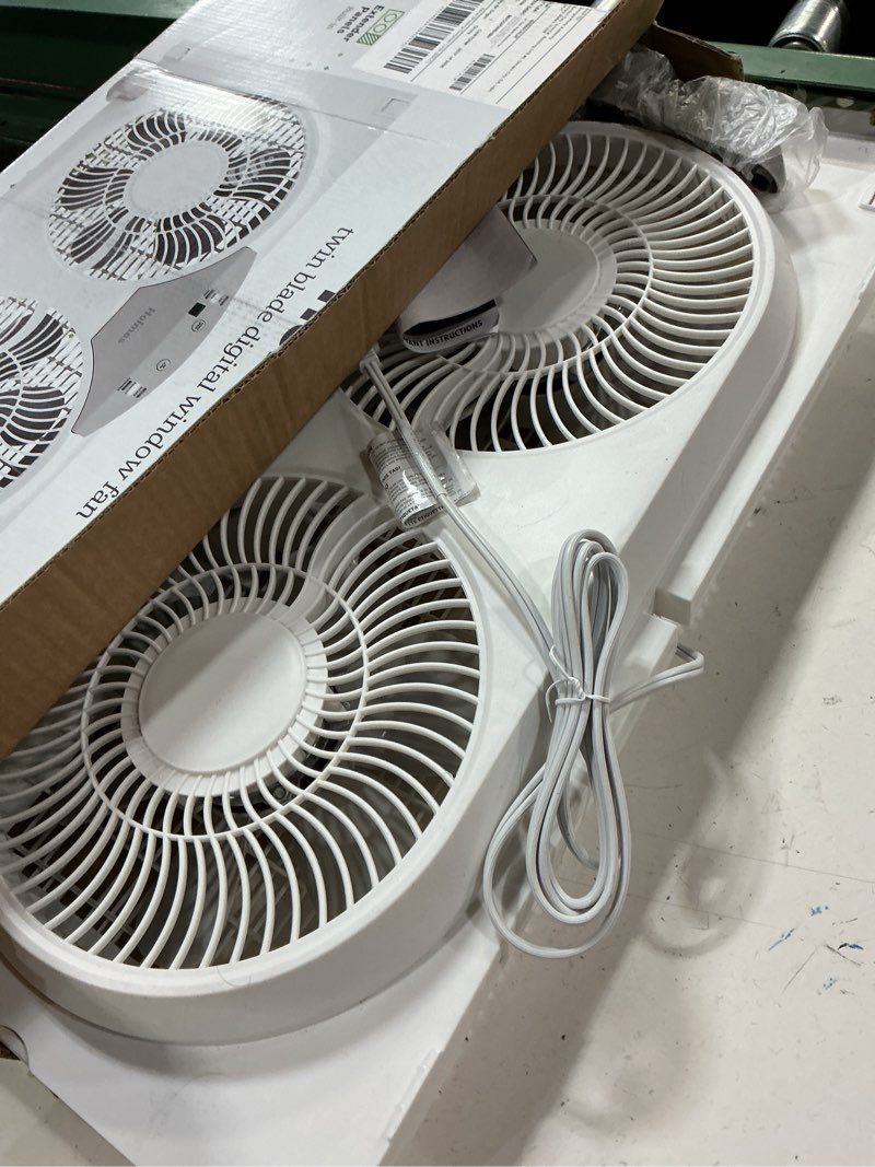 Condition photo showing New/Like New for holmes 9" twin digital window fan, reversible airflow blades, in/out exchange, 3 speeds, built-in extender panels, ideal for home, bedroom or office, remote control, white digital control w/ remote 9 inch