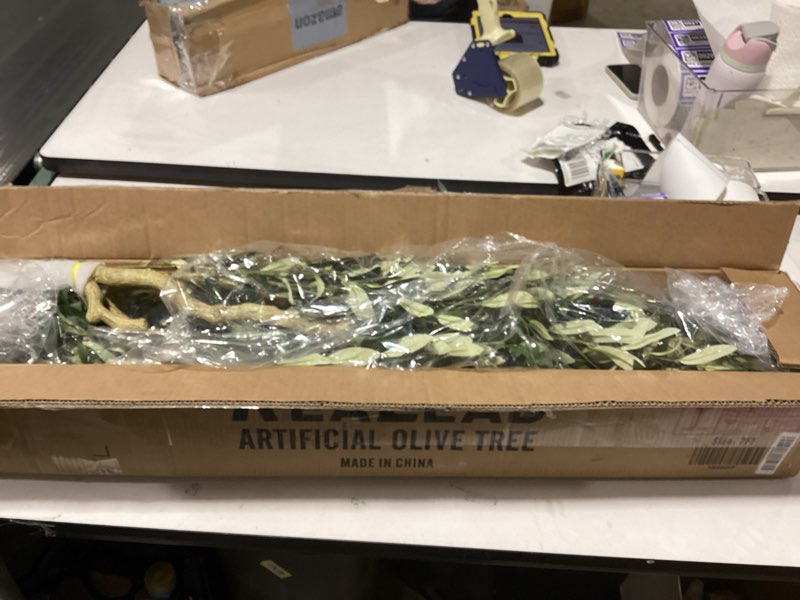 Condition photo showing Good Condition for Realead Faux Olive Tree 7ft - Realistic Tall Olive Trees Artificial Indoor - Large Fake Olive Tree with Natural Wood Trunk and Lifelike Leaves - Artificial Olive Tree for Home Office Decor