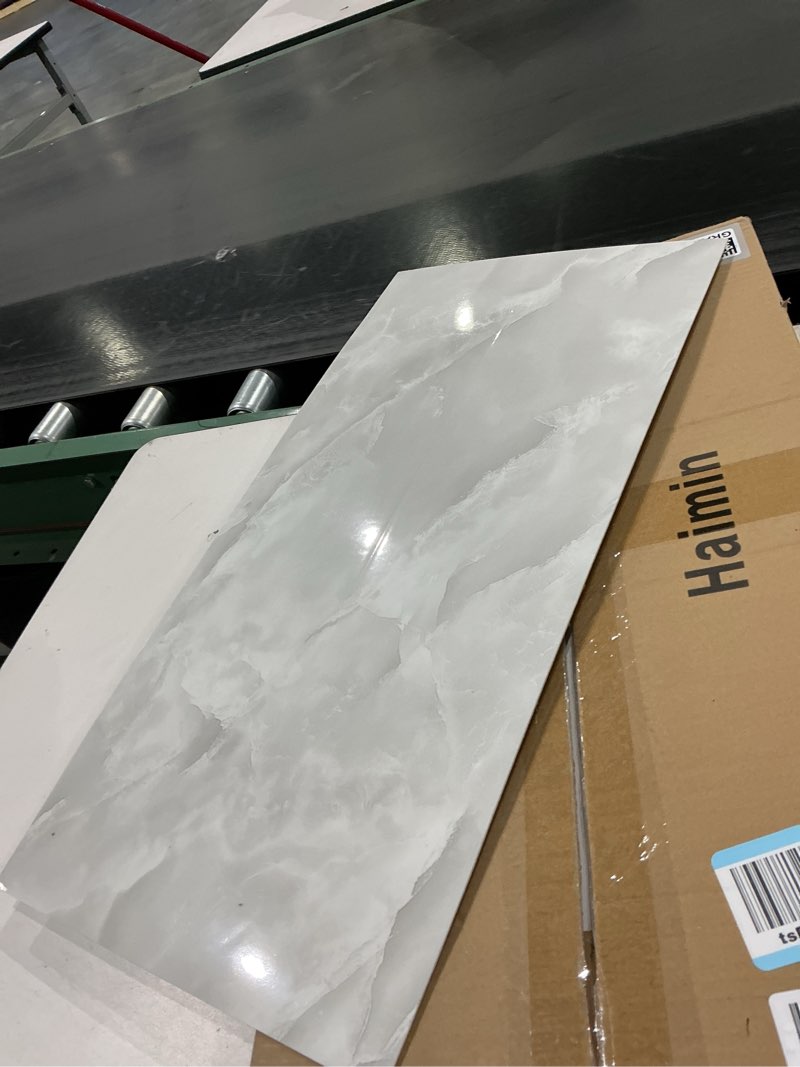 Condition photo showing Good Condition for item similar)))))haimin wall panels peel and stick 10 pieces 23.6x11.8in (19.4 sq.ft. coverage) lightweight backsplash marble look tile (not real marble) ideal for kitchen living rooms bedrooms (light gray-mnh)