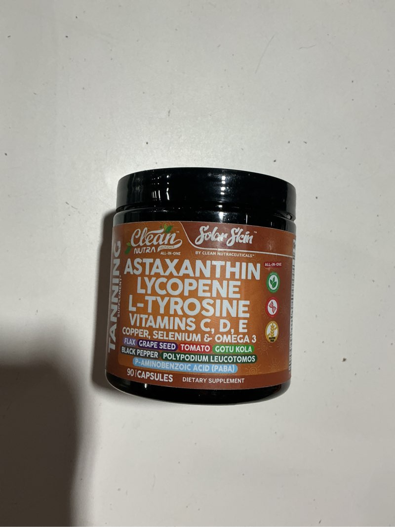 Condition photo showing As Is for solar skin astaxanthin tanning supplement lycopene l-tyrosine vitamins a c d e, paba beta carotene selenium grapeseed extract omega 3 flax seed copper capsules by clean nutra
