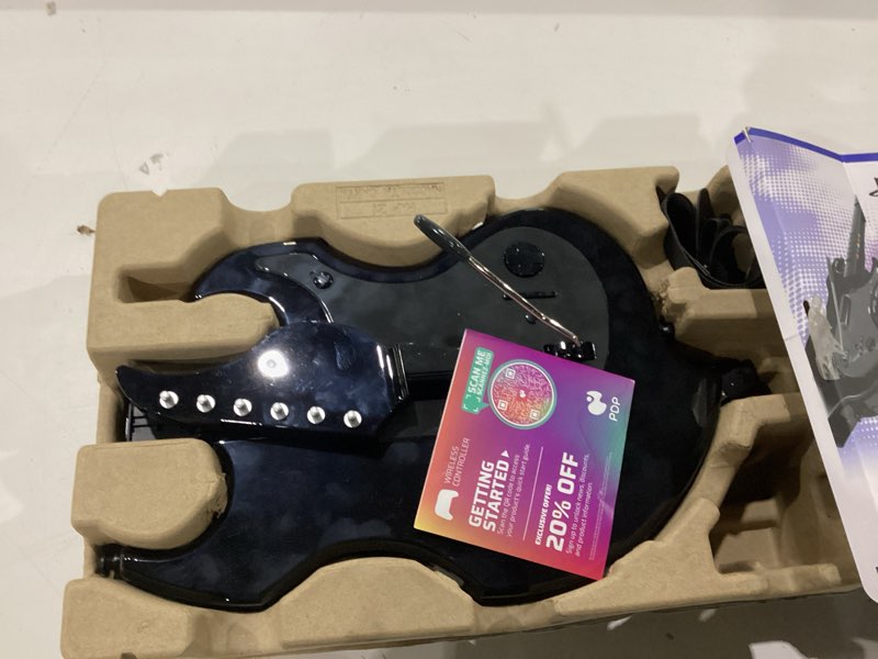 Condition photo showing As Is for not tested ****pdp riffmaster wireless guitar controller for playstation 5 and playstation 4, ps5/ps4, rock band 4, fortnite festival, audio jack, rechargeable battery, officially licensed by sony - black