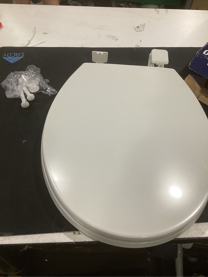 Condition photo showing As Is for project source plastic white round soft close toilet seat