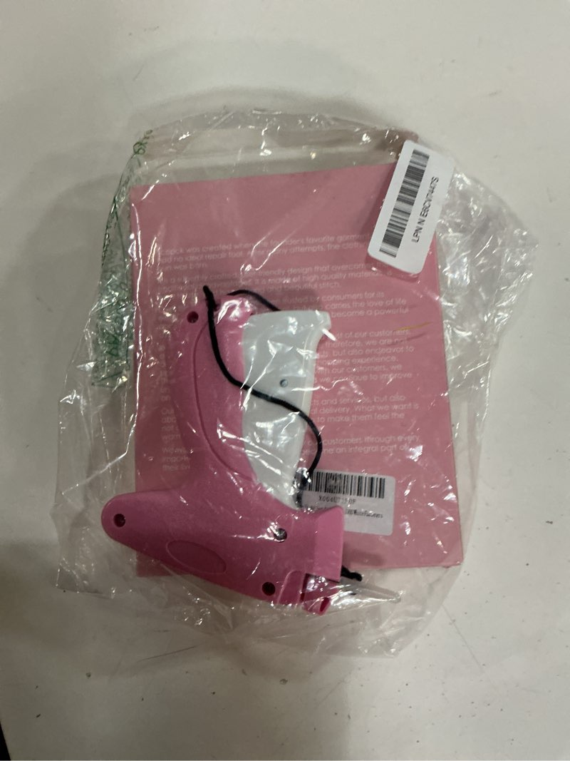 Condition photo showing As Is for stitch gun for clothes - handheld stitch gun quick clothing fixer - tagging gun - includes 6 needle, 1000 black fasteners & 1000 white fasteners pink-white