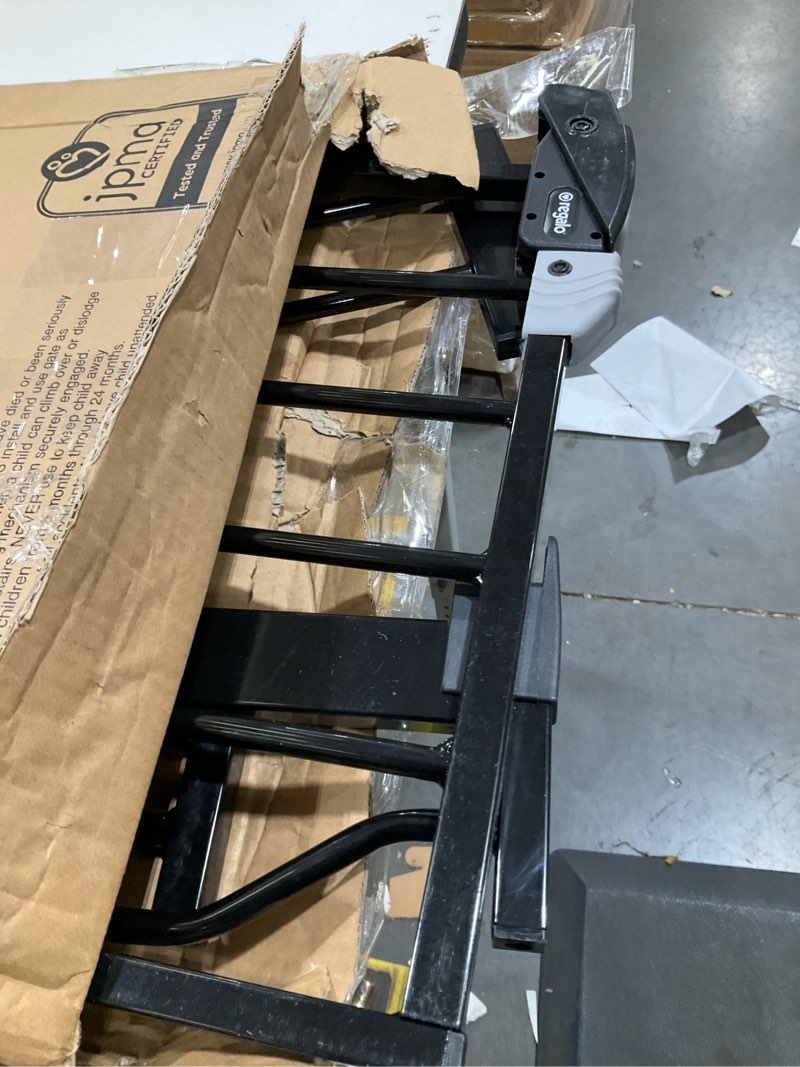 Condition photo showing As Is for Regalo Easy Step 38.5-Inch Wide Walk Thru Baby Gate, Includes 6-Inch Extension Kit, Pressure Mount Kit, Wall Cups, Black Black 29-38.5"W x 30"H