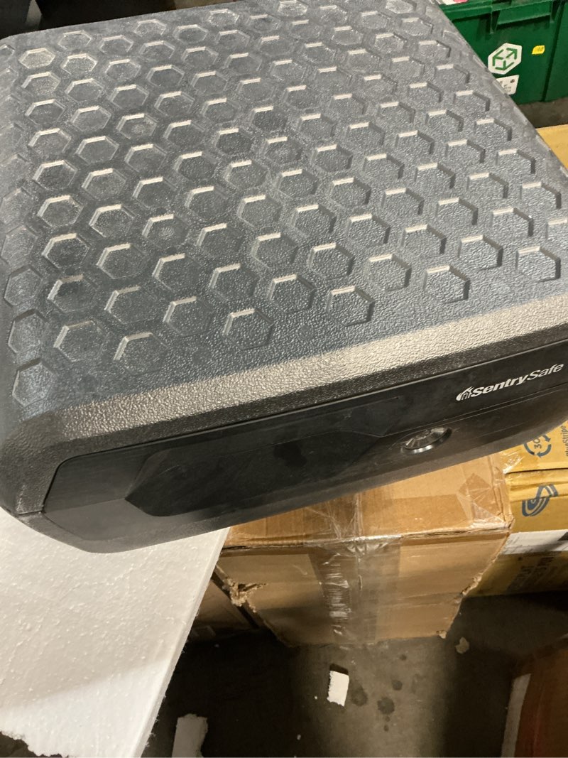 Condition photo showing As Is for (it doesn’t have a key)sentrysafe water and fire safe with key, fire and water chest with key, 7.6 in x 16.5 in x 14.8 in, , .36 cu. ft.