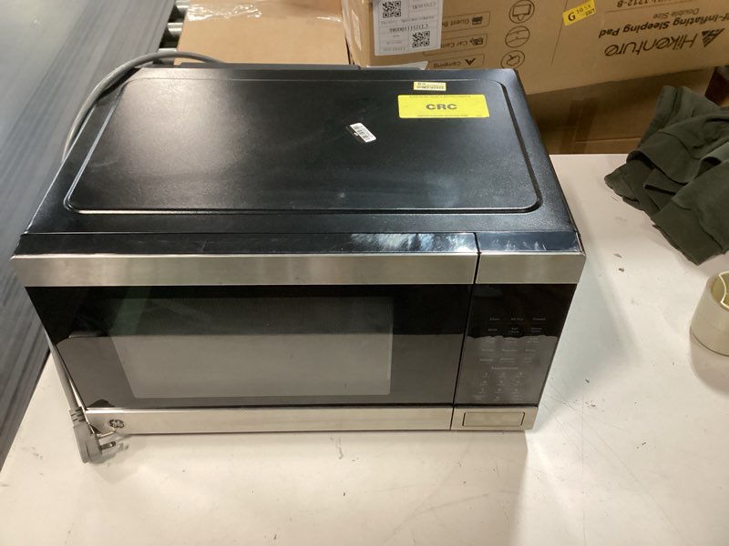 Condition photo showing As Is for ge gcst10a1wss 1.0 cu ft convection microwave oven, 1050w countertop air fry microwave with broil & crisper pan, compact stainless steel design