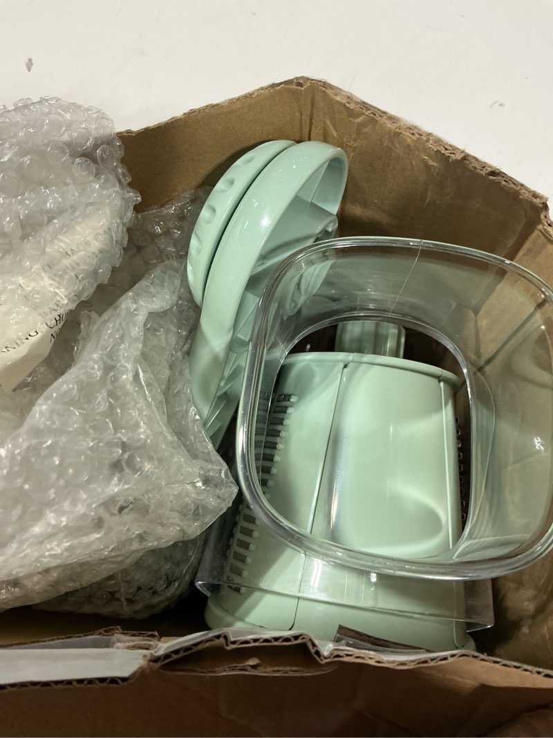 Condition photo showing New/Like New for rotary cheese grater with handle, vegetable shredder with 5 replaceable blades & strong suction base, round food slicer & chopper for kitchen fruit vegetables nuts with blade storage box (green)