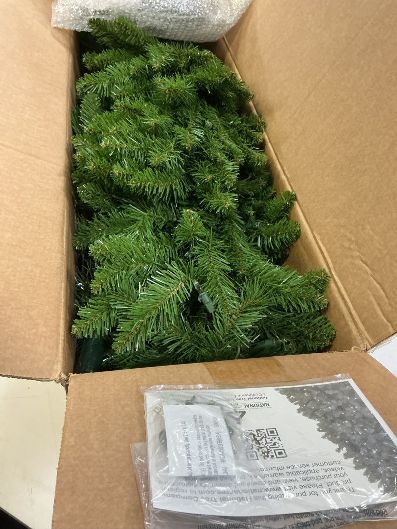 Condition photo showing Good Condition for National Tree Company 6.5 ft Pre-Lit Kingswood Fir Slim Artificial Christmas Tree, 250 Clear Lights, 719 Tips, Includes Stand, Green