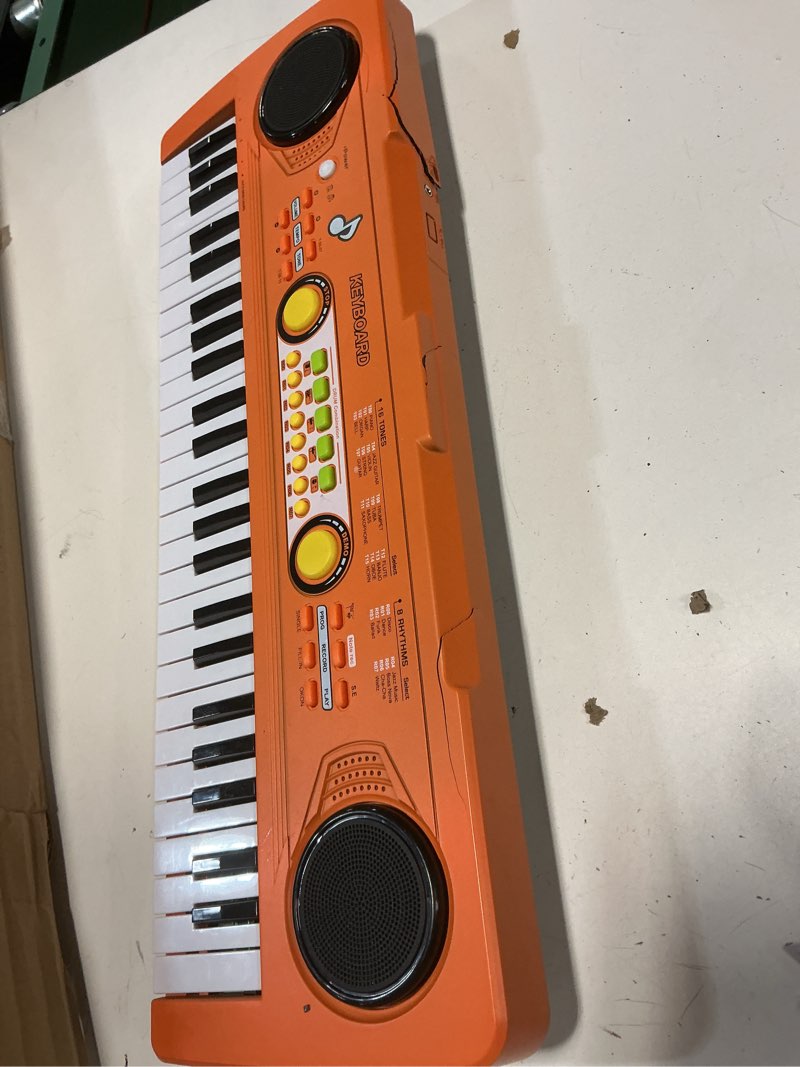 Condition photo showing Good Condition for (defect it’s a broken)Kids Piano Keyboard with Microphone, 49 Keys Portable Electronic Piano Keyboard for Kids Beginners Ages 3 4 5 6 7, Toy Music Keyboard Birthday Xmas Gift for Girls Boys, Orange