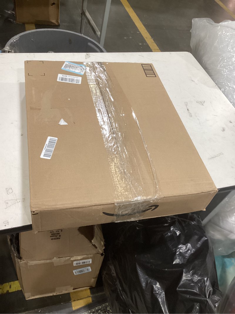 Condition photo showing Good Condition for this item is a collapsible laundry hamper with a mesh bag and bamboo frame.  