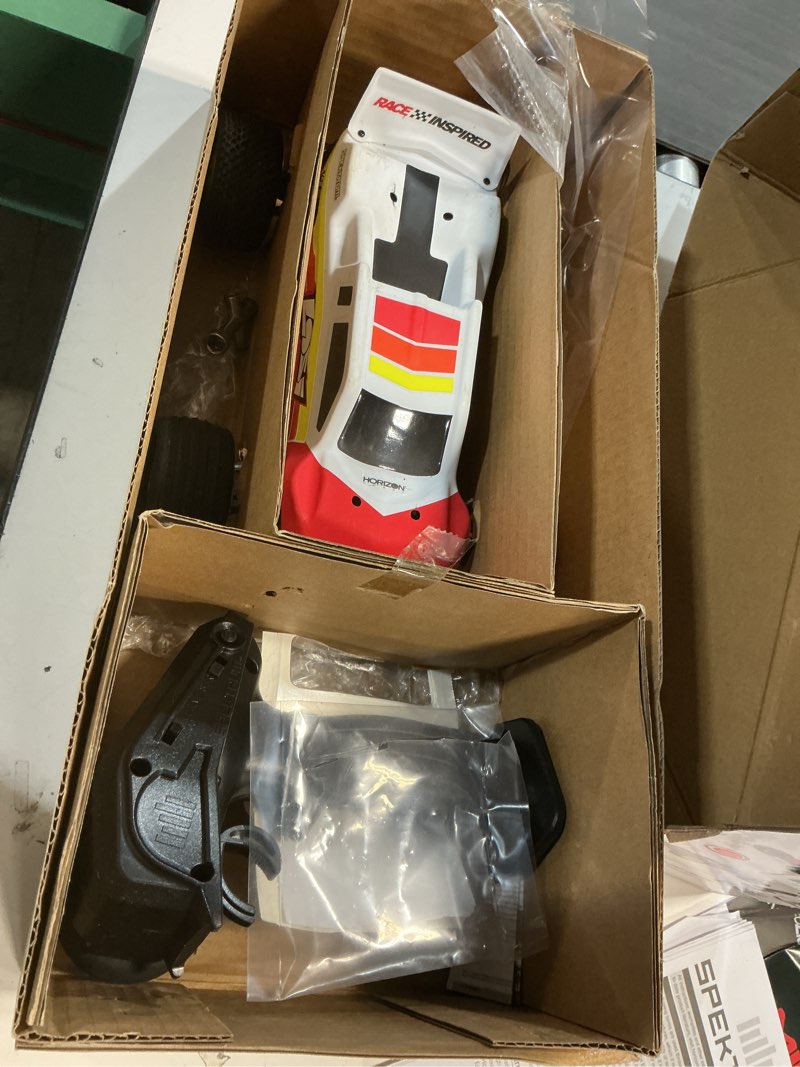 Condition photo showing As Is for losi 1/18 mini-t 2.0 2s 2 wheel drive rtr brushless stadium truck battery & charger included red los-1056t1