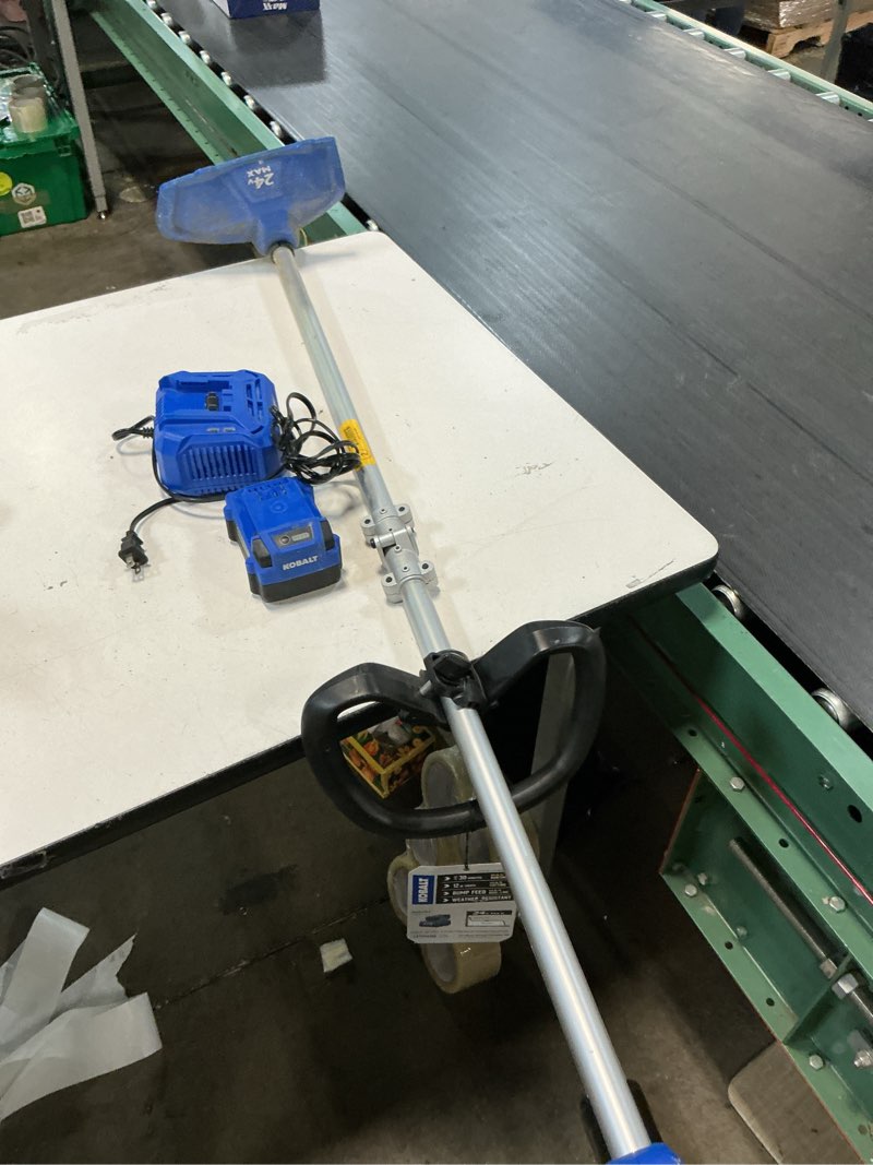 Condition photo showing As Is for kobalt 24-volt 15-in split shaft attachment capable battery string trimmer 4.0 ah (battery included) (charger included)
