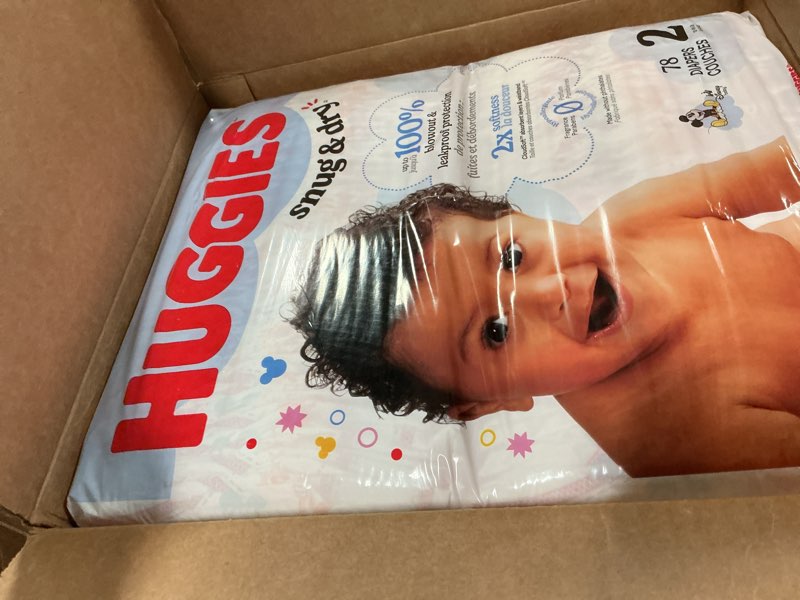 Condition photo showing New/Like New for huggies snug & dry disposable diapers - size 2 - 234ct