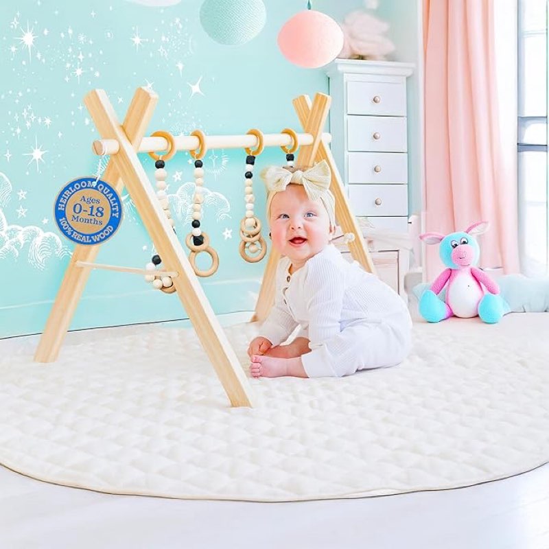 poppyseed play wooden baby play gym, montessori activity center for infants, natural wood frame with 4 hanging toys, foldable baby gym for floor play, tummy time & early development, ages 0–12 months