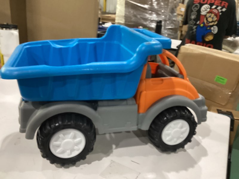 Condition photo showing New/Like New for american plastic toys gigantic loader truck with tilting loading dump bucket, knobby wheels, and metal axels for indoors or outdoors play