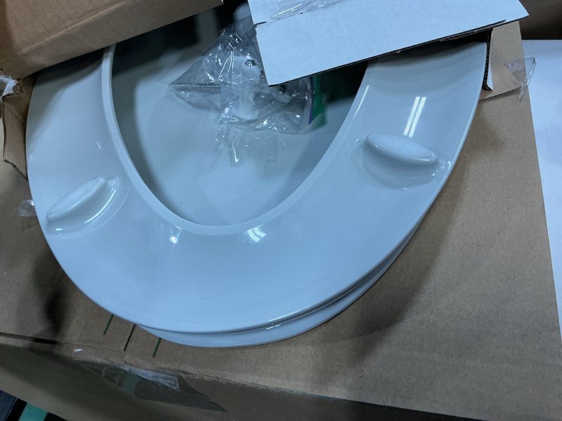 Condition photo showing As Is for "KOHLER 4636-RL-95 Cachet ReadyLatch Elongated Toilet Seat Slow Close, Soft Close Toilet Seat Quiet Lid, Contoured Grip-Tight Bumpers Installation Hardware, Apartment Essentials, Ice Grey " Ice Gray Elongated Ready Latch