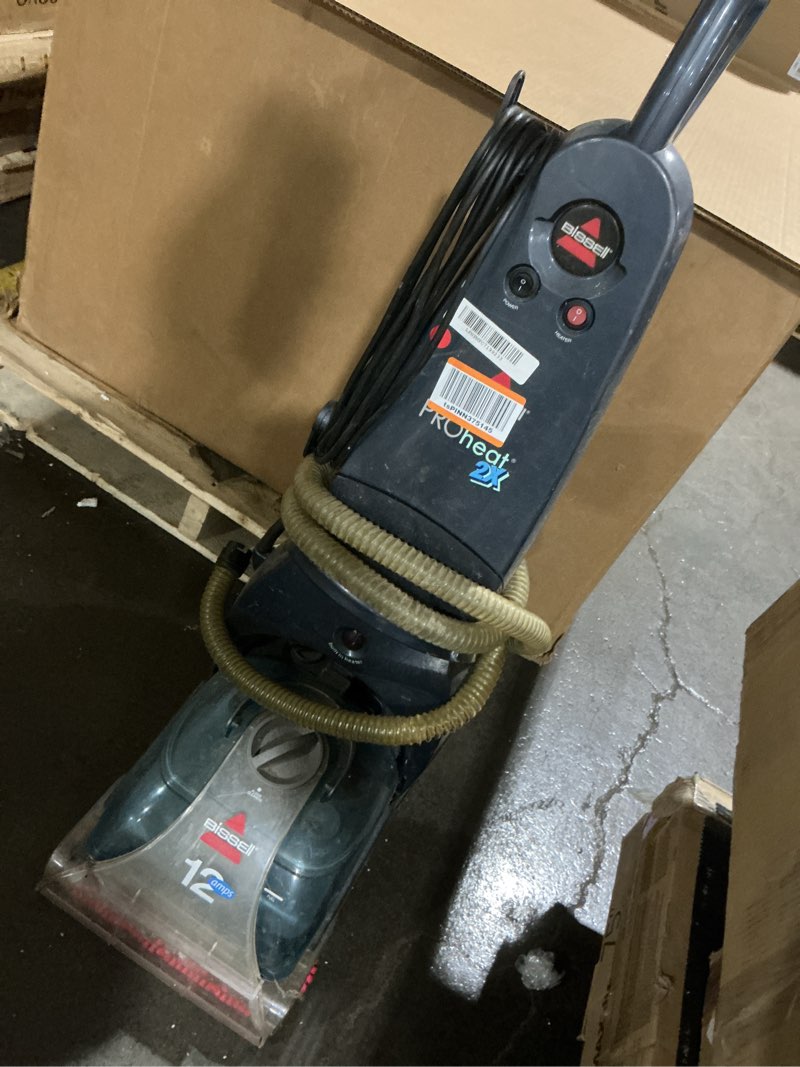 Condition photo showing As Is for (powers on) bissell proheat 2x carpet cleaner