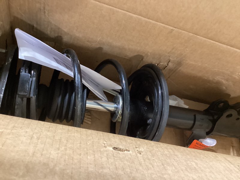 Condition photo showing As Is for monroe quick-strut 172112 suspension strut and coil spring assembly for toyota celica