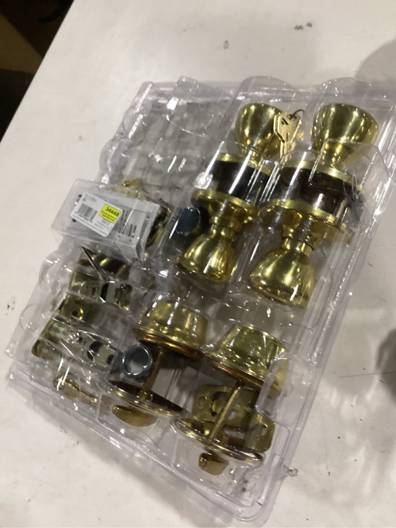 Condition photo showing As Is for kwikset tylo polished brass single-cylinder deadbolt keyed entry door knob (4-pack)
