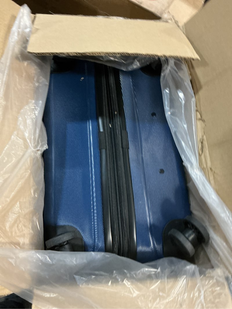 Condition photo showing item condition for Amazon Basics 30" Hardside Large Checked Luggage, Hardshell Suitcase With Wheels, Expandable For Up to 15% More Space, With Scratch-Resistant Surface, Four Multi-directional Wheels, Navy Blue Navy Blue Large Checked