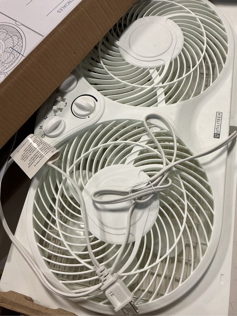 Condition photo showing As Is for utilitech 9in reversible window fan