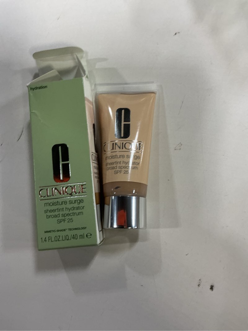 Condition photo showing Good Condition for Clinique Moisture Surge Sheertint Hydrator Hydrating Tinted Moisturizer Broad Spectrum SPF 25 With Hyaluronic Acid + Aloe Water For All Skin Types | Sheer Coverage, Natural Finish AC Light-Medium 03