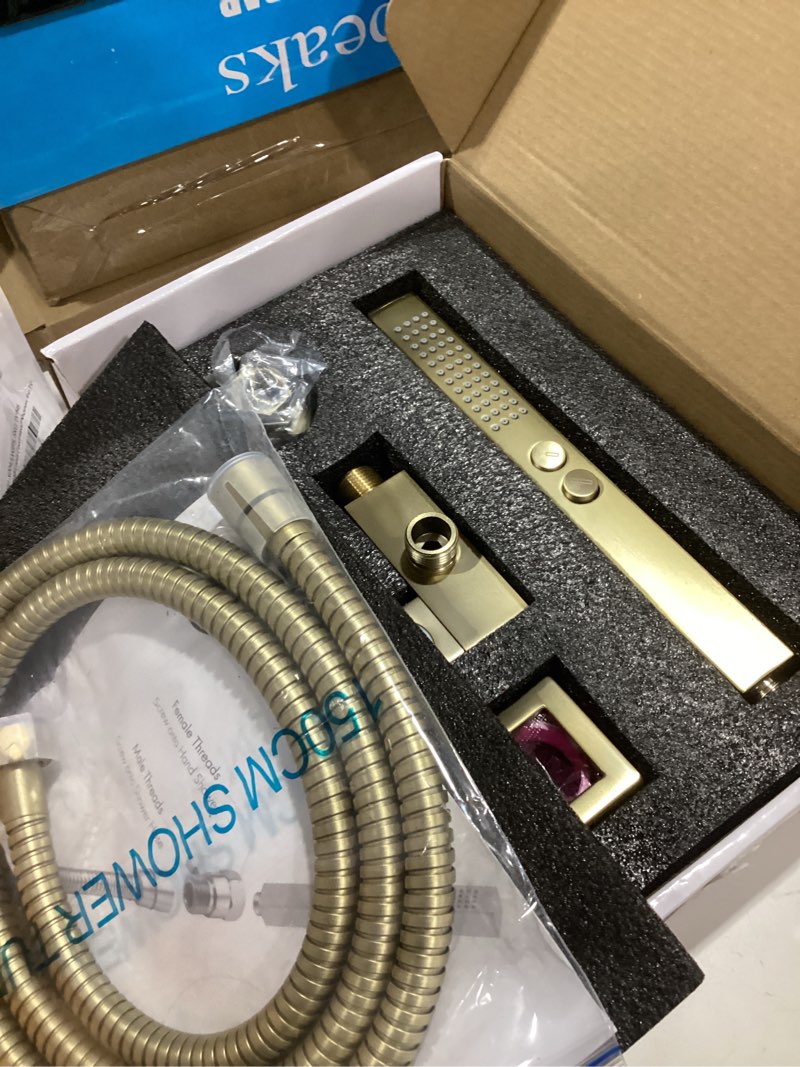 Condition photo showing Good Condition for all-metal high pressure square handheld shower head with jet spray and rainfall modes, volume control regulator, on/off switch, hose and wall mounted adjustable bracket, brushed gold color