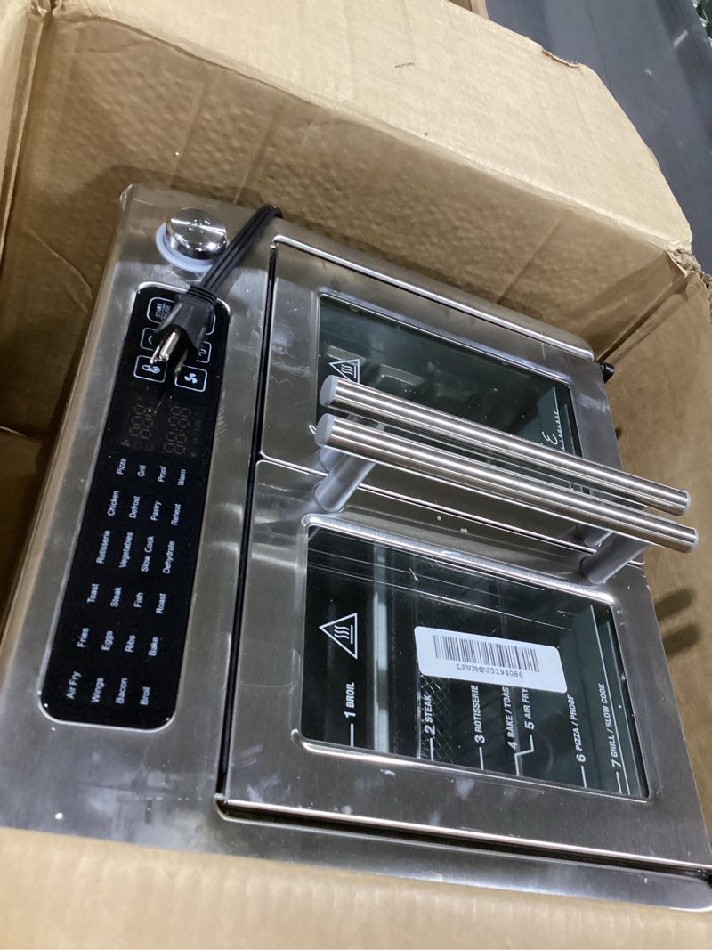 Condition photo showing As Is for Dan - Emeril Lagasse Extra Large French Door Air Fryer Toaster Oven Combo, 24 Cooking Functions and Digital Controls, 7 Accessories Included, Stainless Steel Finish, 26QT Capacity