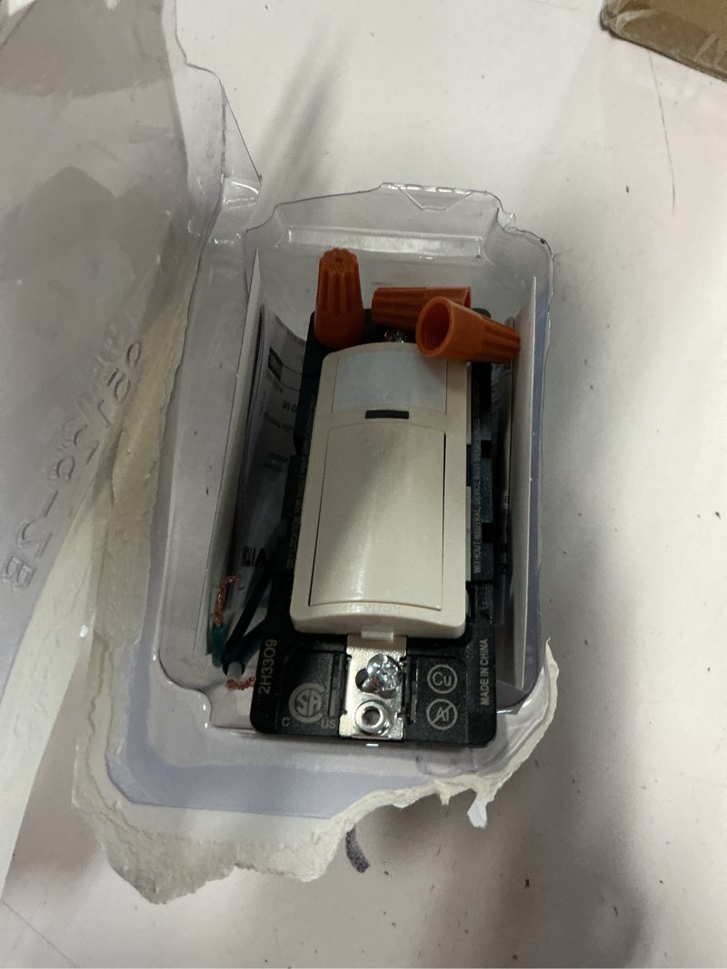 Condition photo showing As Is for leviton motion sensor light switch, motion activated, auto-on/auto-off or manual-on, 2a, no neutral wire required, single pole, dos02-1lt, light almond