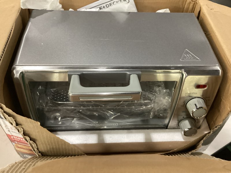 Condition photo showing As Is for black+decker crisp 'n bake air fry countertop convection toaster oven, medium capacity, 4-slice, 5-in-1, fits 9” pizza, 30-min timer, bake, broil, air fry, toast, keep warm, stainless steel, not tested
