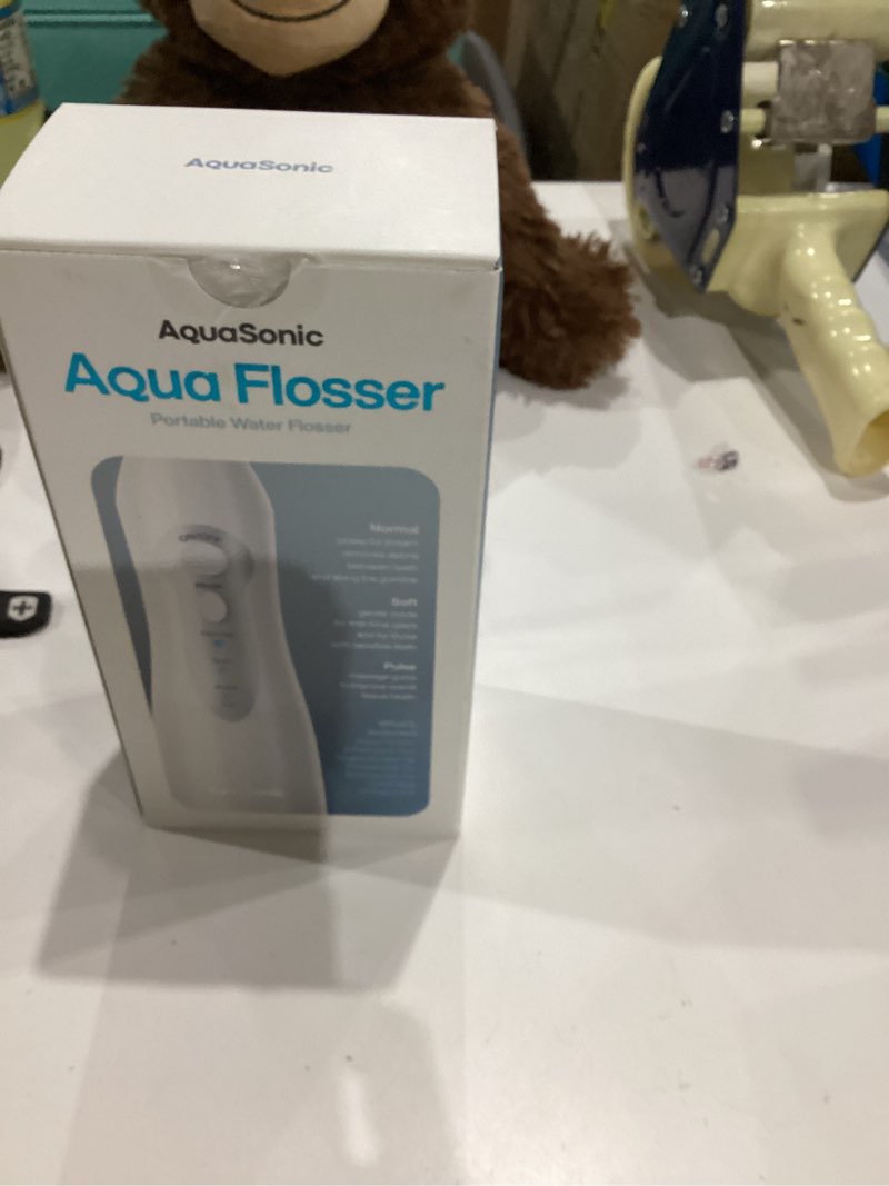 Condition photo showing As Is for AquaSonic Water Flosser - Cordless Rechargeable Water Flossers for Teeth Cleaning - Waterproof Aqua Flosser, Portable Oral Irrigator for Dental Cleaning with 5 Jet Tips – Braces Home Travel. White