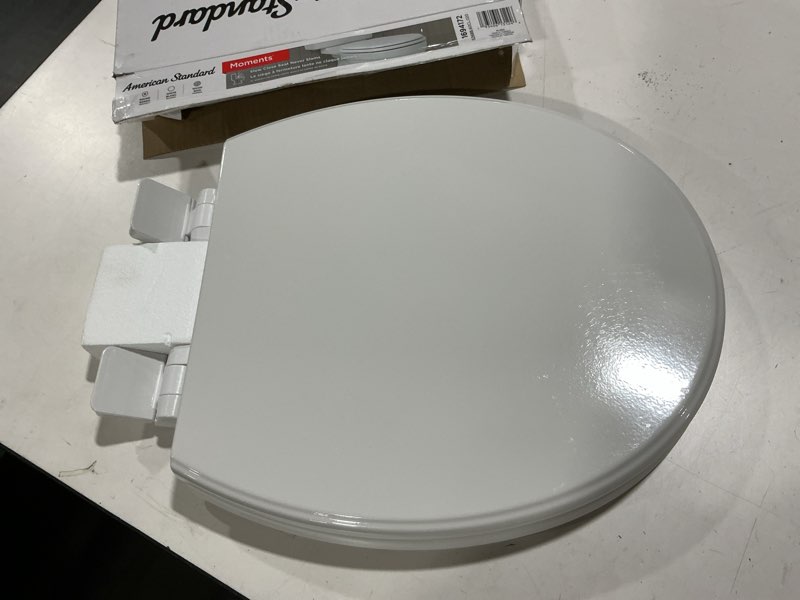 Condition photo showing As Is for American Standard Moments Wood White Round Soft Close Toilet Seat