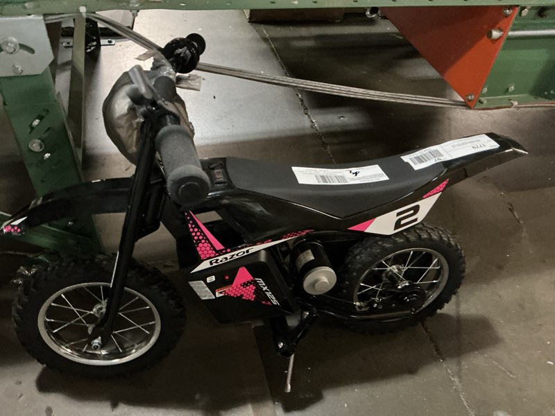 Condition photo showing As Is for razor dirt rocket mx125 electric-powered dirt bike - black with decal included, for child 5+