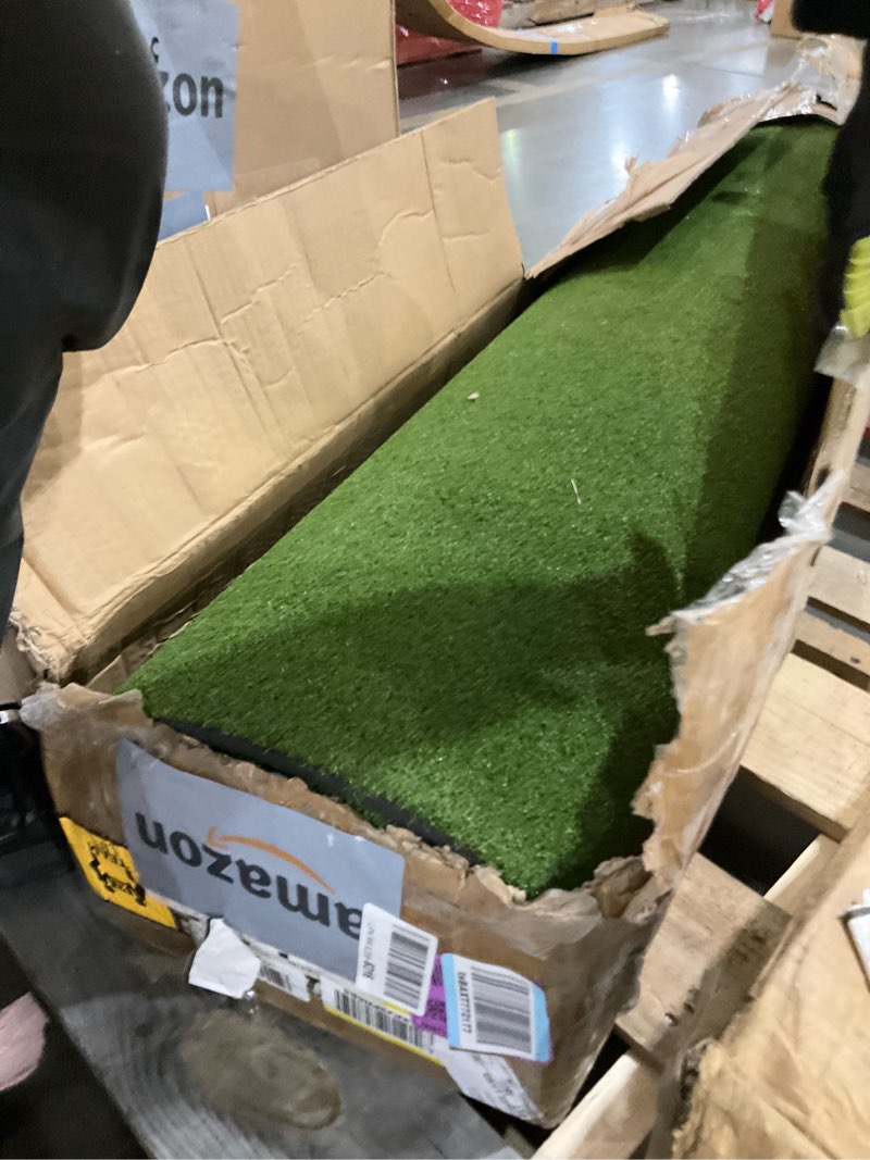 Condition photo showing As Is for faux grass pad