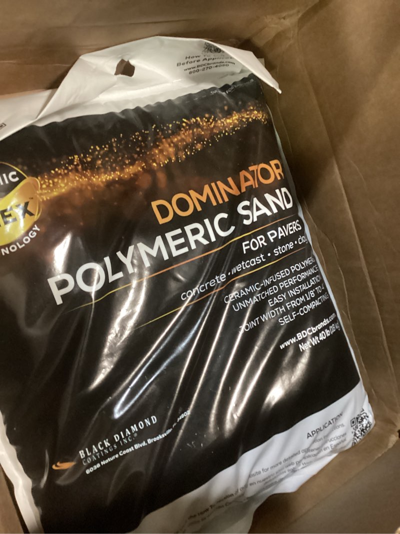 Condition photo showing Good Condition for 40 pound gray beige dominator polymeric sand with revolutionary ceramic flex technology for stabilizing paver joints/gaps, 1/8” up to 4”, professional grade results